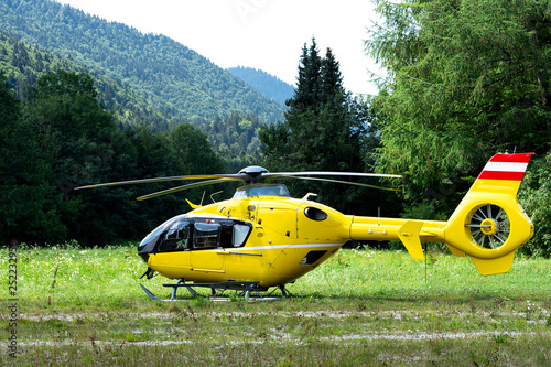 An ambulance helicopter landed in a mountainous village in the field.