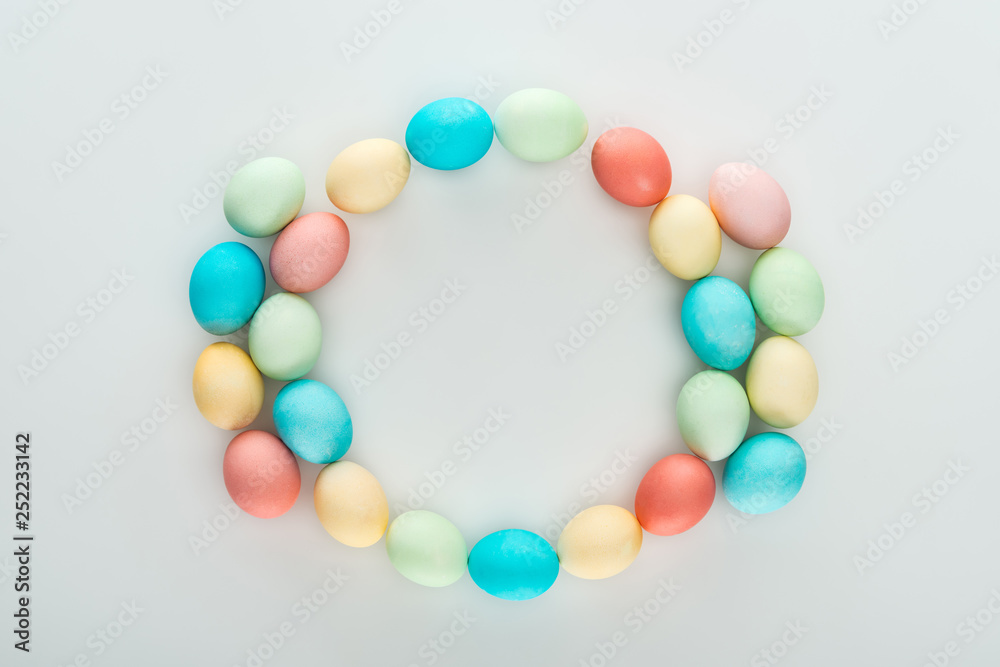 top view of colorful easter eggs as frame isolated on grey top view of colorful easter eggs as frame isolated on grey