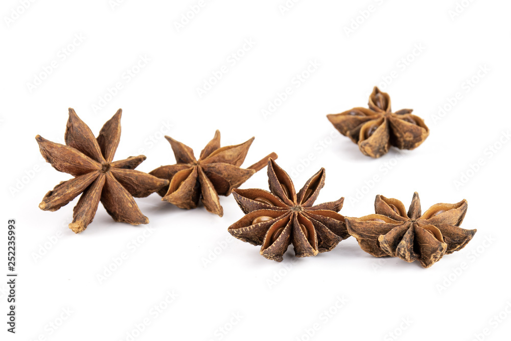 Group of five whole dry brown star anise fruit isolated on white background Group of five whole dry brown star anise fruit isolated on white background