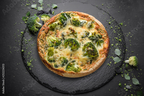 Vegetable quiche with broccoli and cheese. Vegetarian pie.