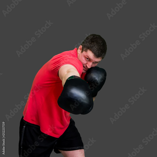 White male boxer in Boxing stand during training isolated on grey background 3