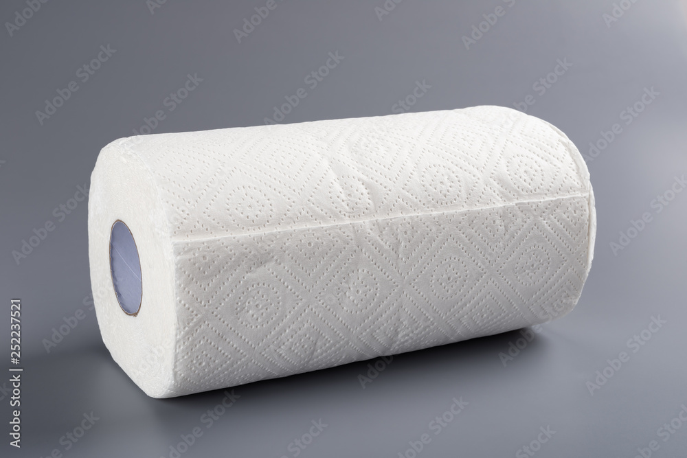 Fototapeta premium brand new paper roll for kitchen on grey background