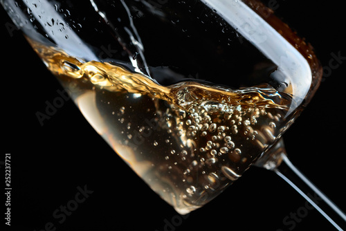 White wine being poured into glass. © Igor Normann