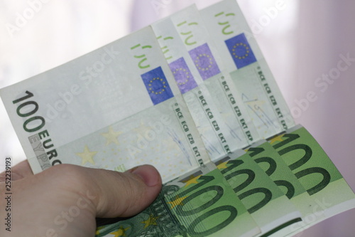 hand with money isolated on white background 400 euros in hand photo