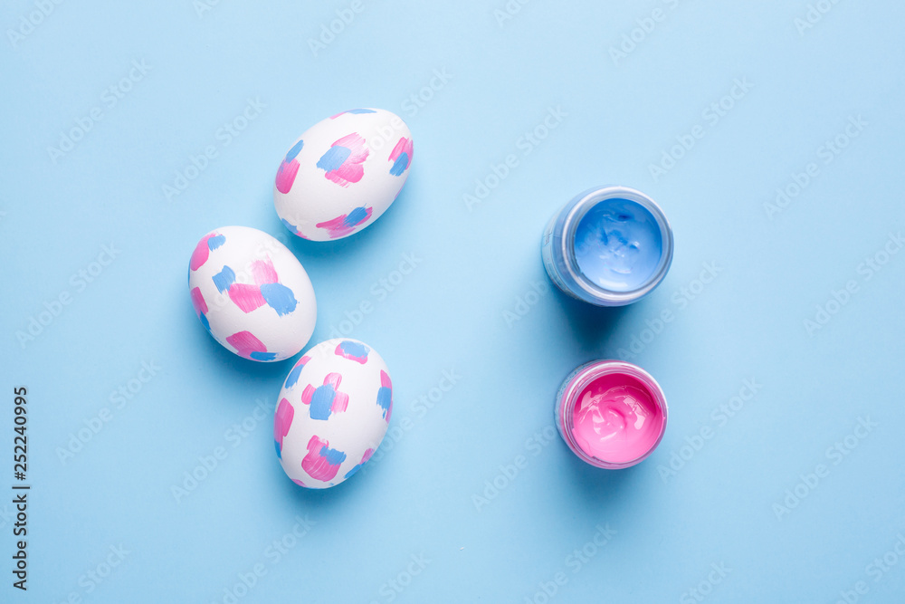 Easter eggs with watercolor brushstrokes on a blue background Easter eggs with watercolor brushstrokes on a blue background