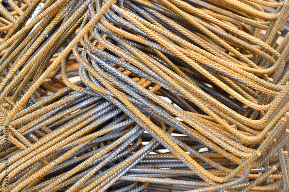 A heap of rusty iron poles on a construction site in Berlin-Germany. A heap of rusty iron poles on a construction site in Berlin-Germany.