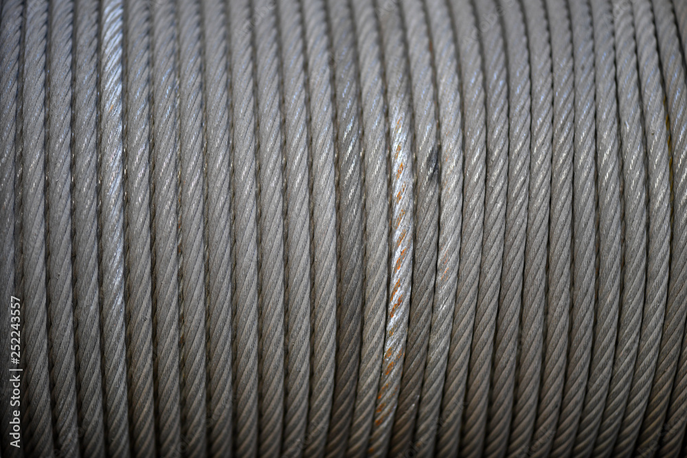 A steel rope on a roll of a crane. A steel rope on a roll of a crane.