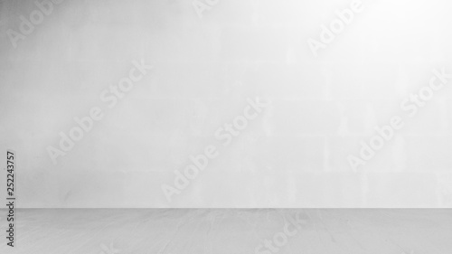 Cement wall with floor in the empty room and light for background.