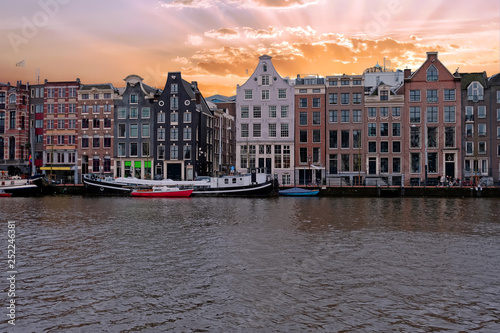 Medieval houses along the river Amstel in Amsterdam Netherlands