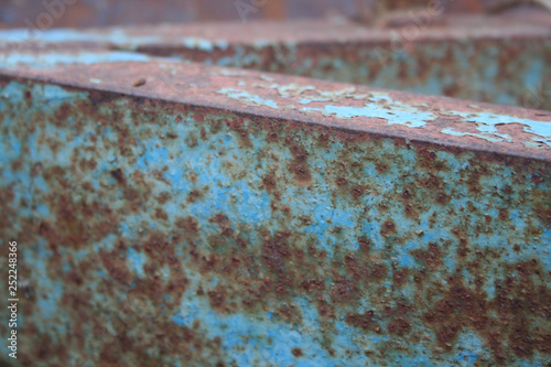 Rusted metal texture with peeling paint. Old metal wallpaper