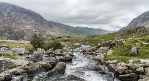 Beautiful rocky stream and surrounding mountain range at Llyn Idwal, Pont Pen-y-benglog, Bangor, Wales, UK