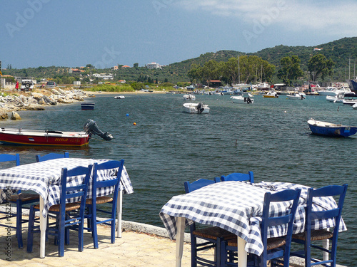 Dining tables in bay near Skiathos Airport, Greek Islands