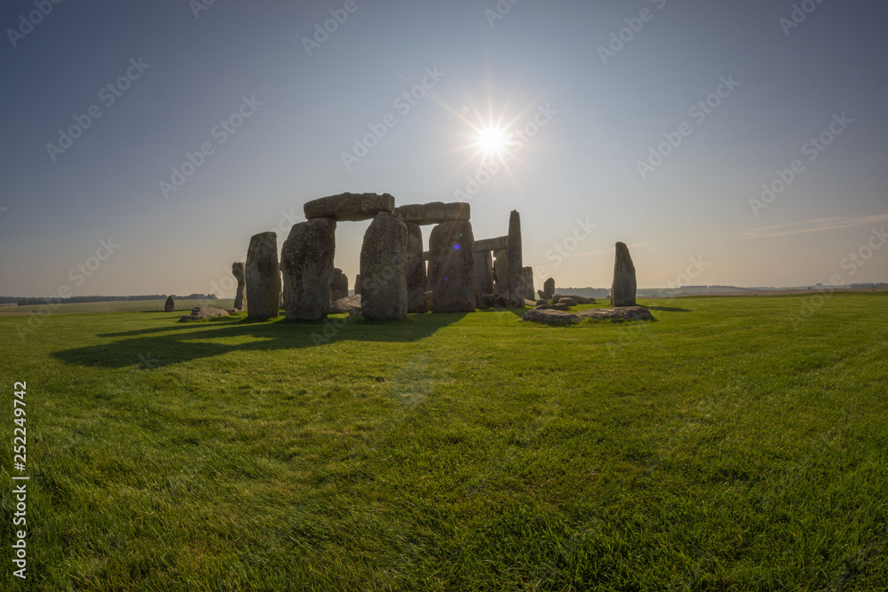stonehenge at sunrise, clear sunny day