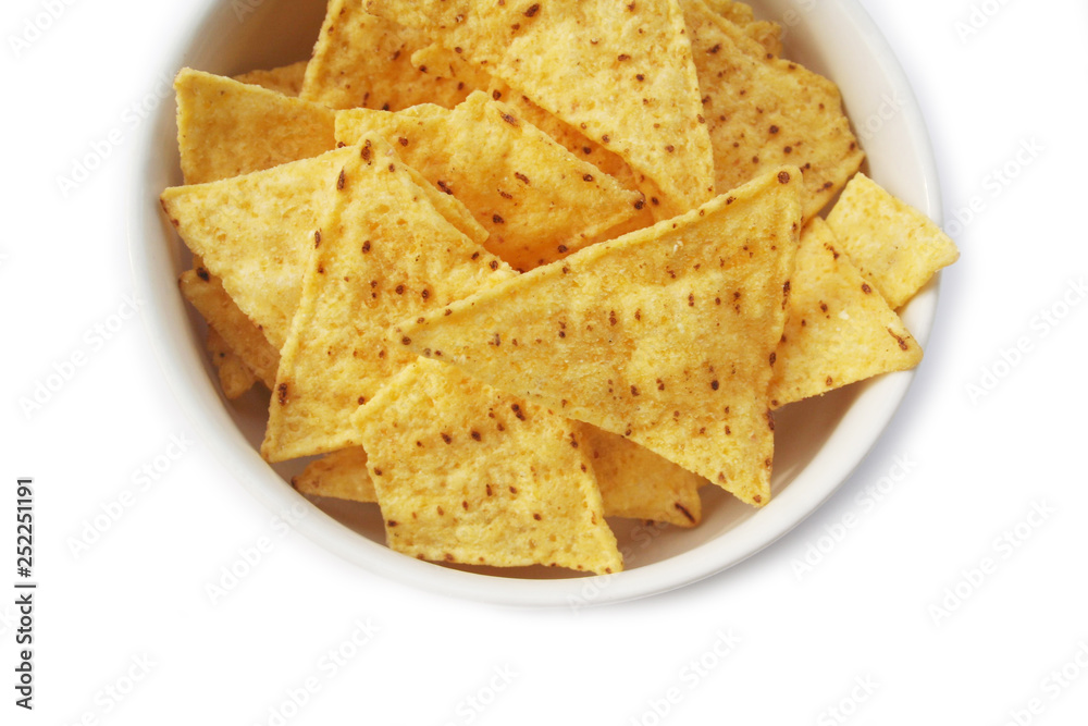Corn Totillas chips in a bowl isolated on white background. Mexican food also called Nachos Corn Totillas chips in a bowl isolated on white background. Mexican food also called Nachos