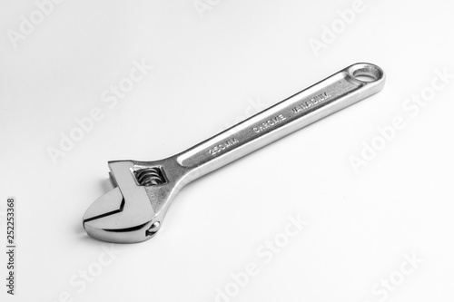 Adjustable wrench isolated on white background. Sliding metal wrench isolated on white