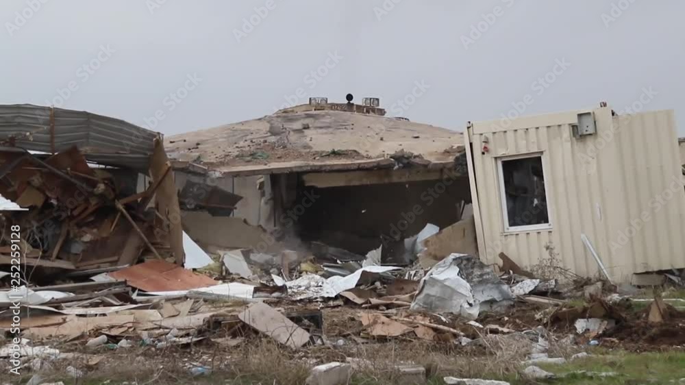 Military bulldozer tearing down a structure 3 Military bulldozer tearing down a structure 3