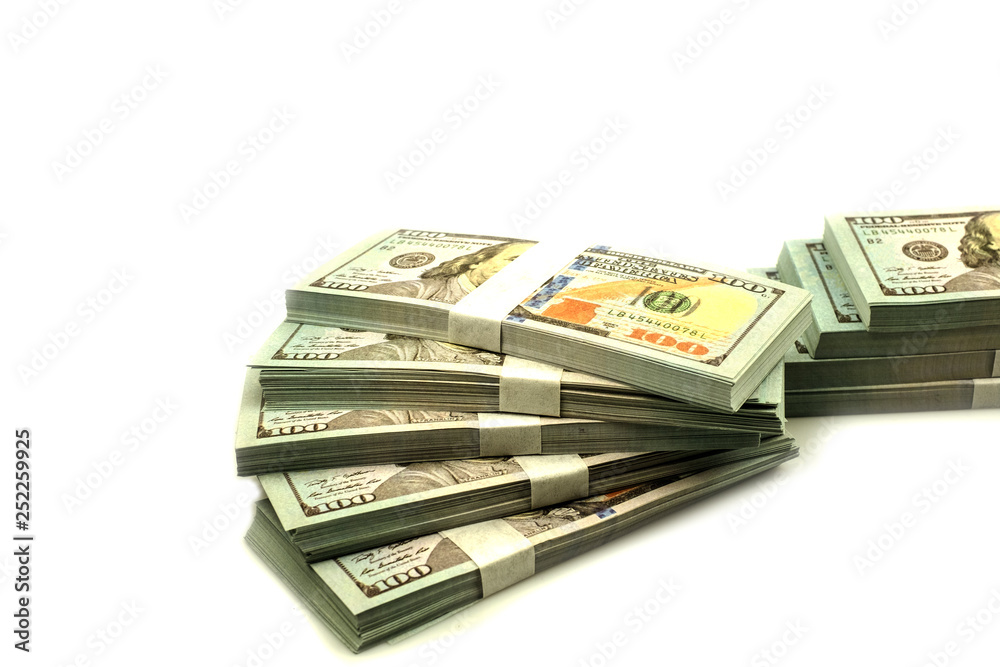 Stack bundles of 100 US dollars banknotes on white background Stack bundles of 100 US dollars banknotes on white background