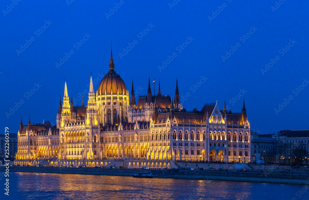 Hungarian parliament in Budapest, illuminated building in the night Hungarian parliament in Budapest, illuminated building in the night