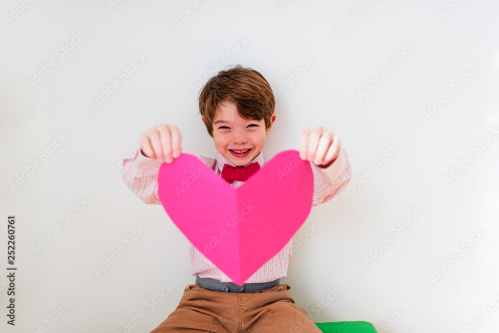 Portrait of a young boy wearing pink Portrait of a young boy wearing pink