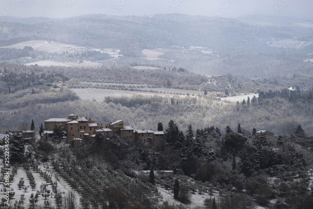 The Chianti landscape in the Tuscan hills after a winter snowfall. Chianti, Tuscany, Italy