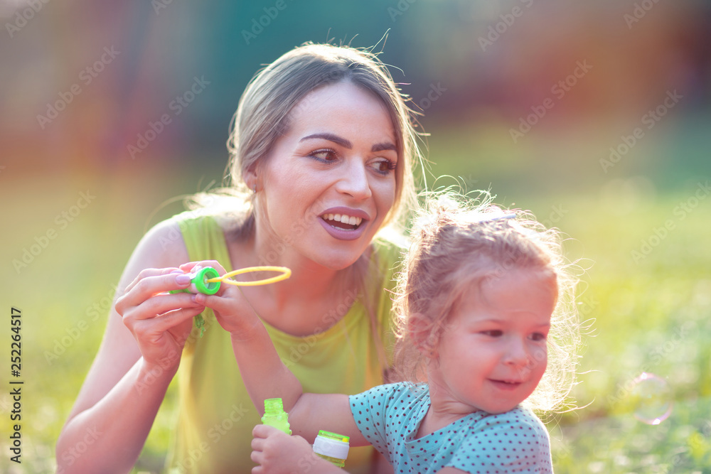 Happy Childhood – Family blows soup foam and make bubbles .