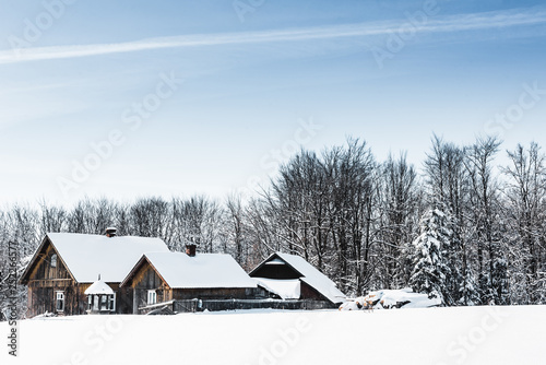small wooden village covered with snow in carpathian mountains