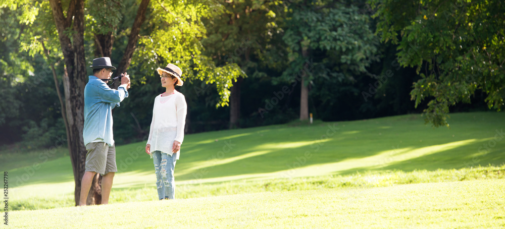 Fototapeta premium Image of happy romantic Asian senior couple outdoor in park