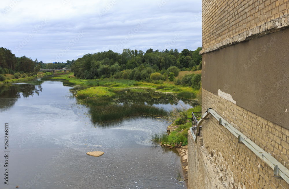 Embankment of hydroelectric power on the river.