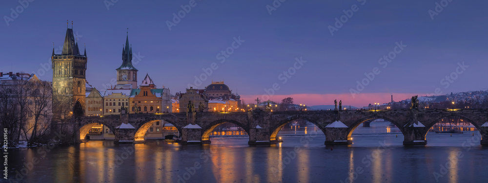 Beautiful panorama night view of Charles Bridge over Vltava river in Prague city,