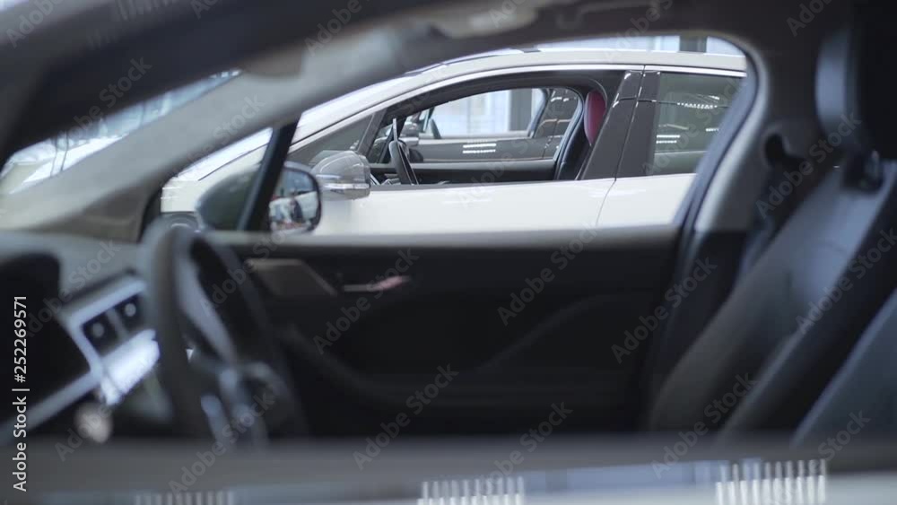 Auto standing in a row at a car dealership. Car showroom. Auto standing in a row at a car dealership. Car showroom.