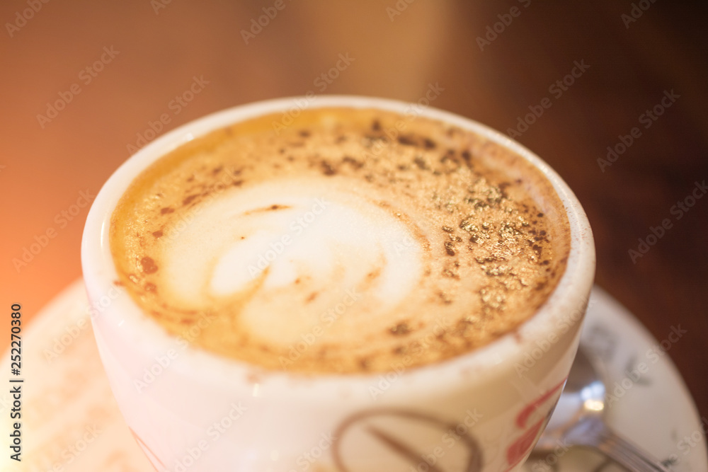 delicious Italian cappuccino with a froth on a wooden table, a great tonic drink delicious Italian cappuccino with a froth on a wooden table, a great tonic drink