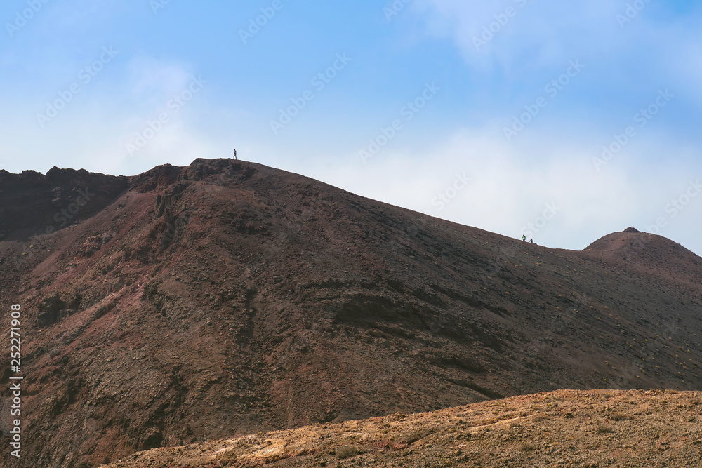 Beautiful landscape with hikers at the volcano Teneguia. La Palma, Canary islands, Spain. Concept holiday, tourist on vacation background.