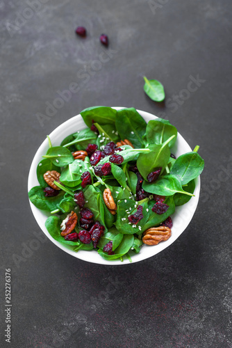 Spinach salad with pecan nuts and cranberries