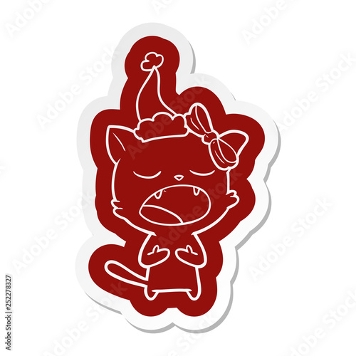 cartoon  sticker of a cat meowing wearing santa hat