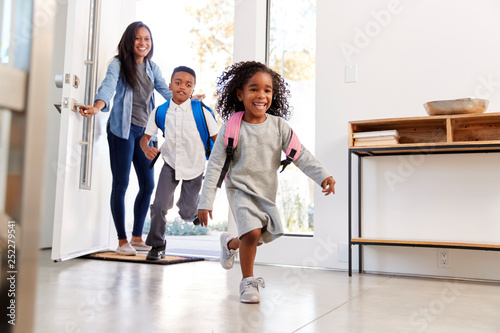 Photography Mother Collecting And Bringing Son And Daughter Home After School