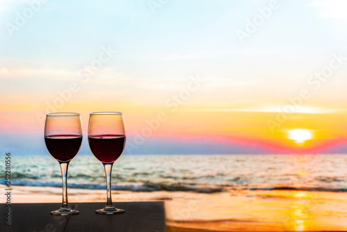 Two glasses of Red Wine Overlooking the sea during the sunset