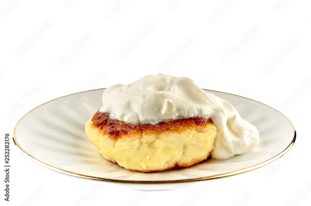 Cheesecake with sour cream in a plate on a white background, isolate Cheesecake with sour cream in a plate on a white background, isolate