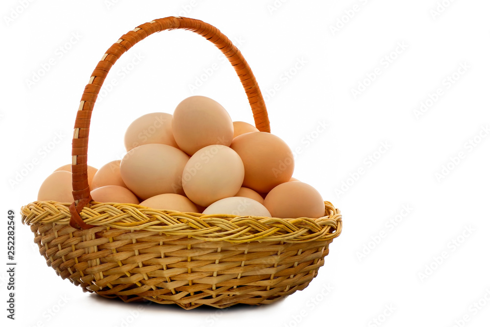 Chicken eggs in a wicker basket - a natural product, useful and nutritious food. Chicken eggs in a wicker basket - a natural product, useful and nutritious food.