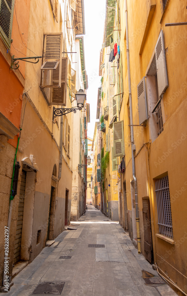 colorful narrow street in Nice on french riviera, cote d'azur, south France