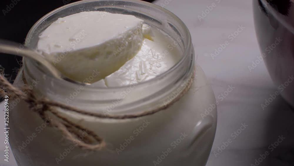 Organic yogurt in a glass jar. Organic yogurt in a glass jar.