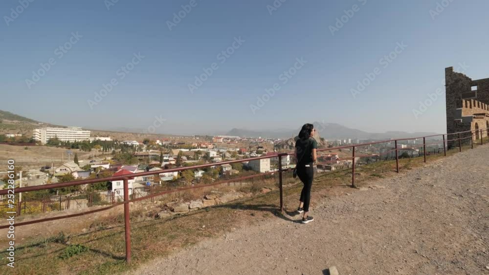 she is on a viewing platform she is on a viewing platform