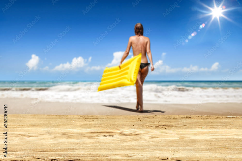Desk of free space and beach landscape with sun on blue sky Desk of free space and beach landscape with sun on blue sky