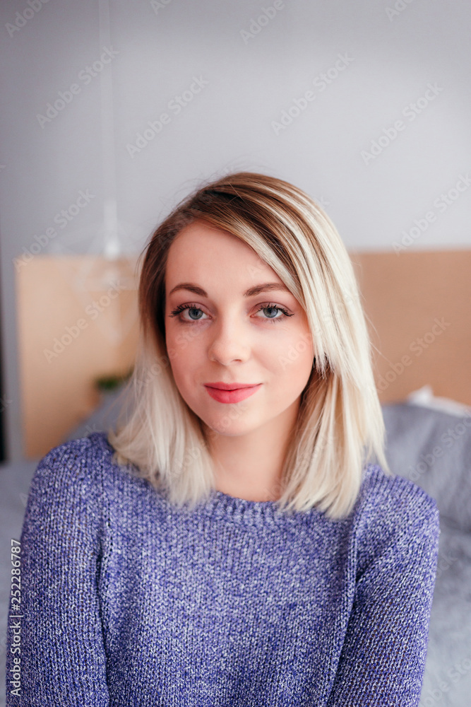 Portrait of a young beautiful woman in a sweate Portrait of a young beautiful woman in a sweate