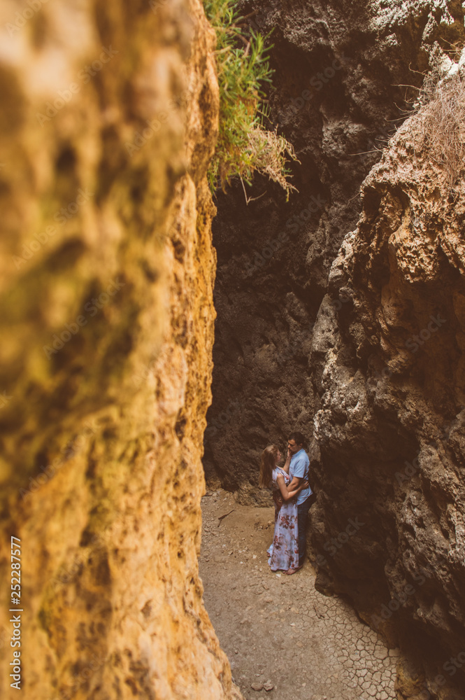 Man and woman walking in the cleft Man and woman walking in the cleft