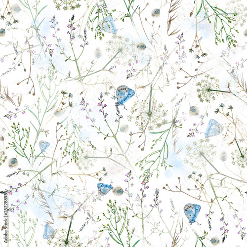 Watercolor floral seamless pattern with wildflowers and delicate blue butterflies in a watercolor spray on white background.