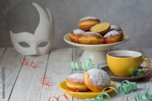 Bombolone - filled sweet yeast dough fried in oil, with a cream. Italian carnival  doughnuts. photo