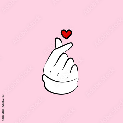 Korean love sign on a pink background, fingers and heart