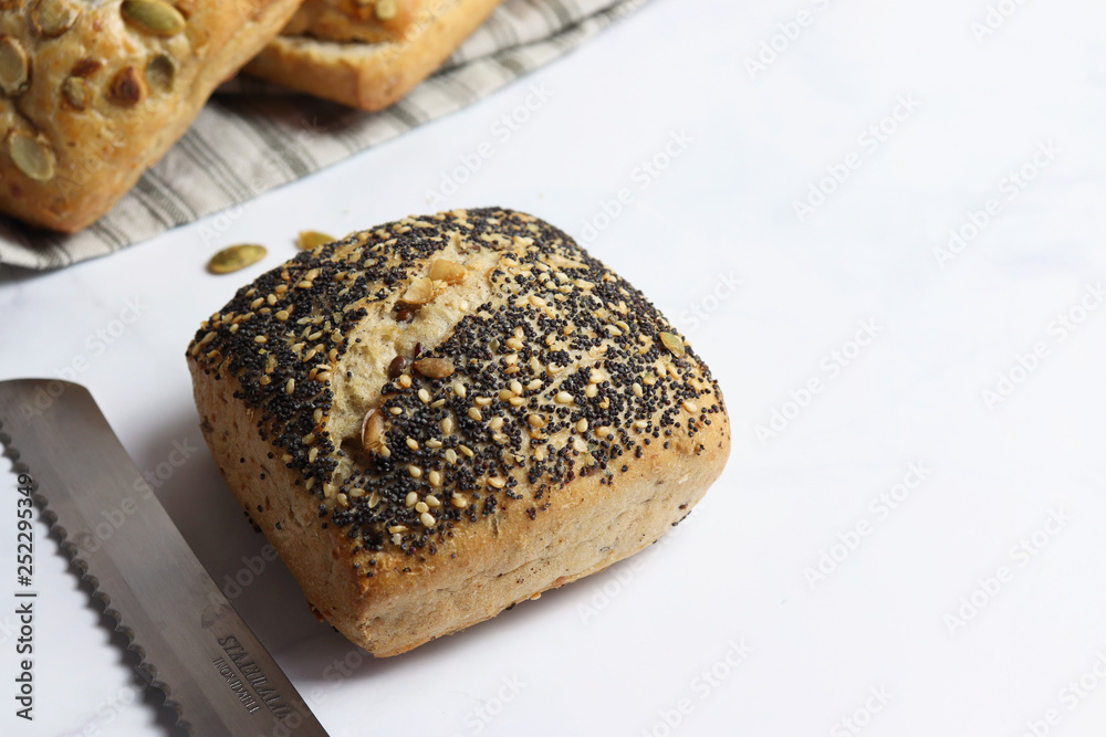 Freshly baked square shaped buns with seeds