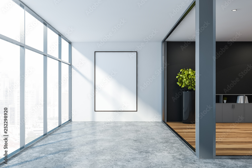 Lobby of gray and white office with poster