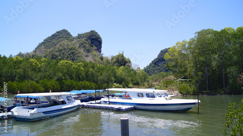 KUAH, LANGKAWI, MALAYSIA - APR 07th, 2015: tourists ride speed boat to visit mangroves at KILIM Geoforest park of Langkawi island